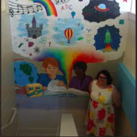 <p>New Fairfield resident Allison Fagans painted a 9-foot-2-inch high by 6-foot-7-inch wide mural at the New Fairfield Library.</p>