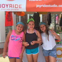 <p>Young girls enjoy visiting the JoyRide booth at the Darien Chamber of Commerce Sidewalk Sales last weekend.</p>