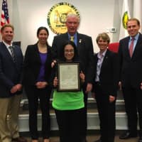<p>Tammy Irwin-Smith (center) earned a proclamation from Fair Lawn&#x27;s Mayor and Council</p>