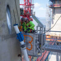 <p>The first cables were hung on the new Tappan Zee Bridge.</p>