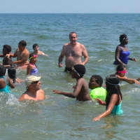 <p>Children play at the beach in Bridgeport&#x27;s Seaside Park, which also saw lower water quality in 2016 vs. 2015.</p>