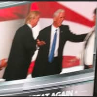 <p>Donald Trump and Mike Pence on the big screen</p>