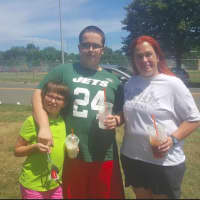<p>The Siecienski family put down their cellphones for a moment to pose for a photo. They are at Rogers Park in Danbury playing Pokemon Go. From left, Megan, 9; Jason, 15; and Mary, 45.</p>