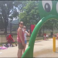 <p>Parents and kids alike keep cool at Rogers Park sprayscape in Danbury on one of the hottest days of the summer.</p>