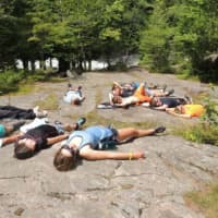 <p>Weary campers chill after a long day canoeing on Tupper Lake in New York as part of the Daniel Barden Scholarship Adventure.</p>