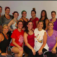 <p>A &quot;Christmas in July&quot; class held at Feeling Fit exercise studio in Brookfield. Participants exercised in holiday attire.</p>