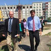 <p>U.S. Sen. Chris Murphy, D-Conn., at right, walking with Stamford State Rep. Dan Fox, D-148th District at the under construction Metro Green III apartments in Stamford.</p>