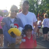<p>Shannon and Jim Lombardo of Easton with their 7-year-old son Evan. They also have a 6-year-old son Nico. The kids are having fun at the 75th annual Easton Fireman&#x27;s Carnival.</p>