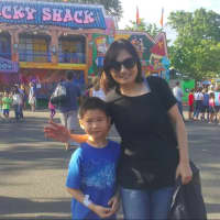 <p>Linda Weng with her 7-year-old son Matthew have been coming to the carnival for three years.</p>