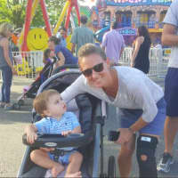 <p>Julie Gurney with her 15-month old son Dean. Gurney&#x27;s 7-year-old twins John and Allan are having fun on the carnival rides.</p>