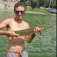 <p>Schenectady&#x27;s Julian Canavan holds the Alligator Gar he caught before returning it to mother nature — even though it&#x27;s domesticated.</p>