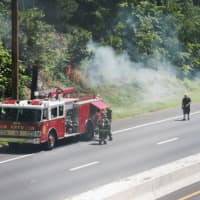 <p>The GRFD extinguishes a brush fire Sunday.</p>
