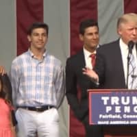 <p>Donald Trump started his rally Saturday night by inviting an 18-year-old from Fairfield, Giacomo Brancato (center), battling cancer to the stage with his family.</p>