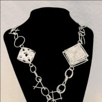 <p>This necklace won a gold metal in Scholastic and came in first in the National Metals Competition.</p>
