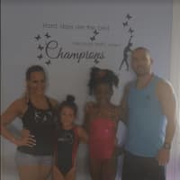 <p>The Gold winners and their coaches at Kratos Gymnastics &amp; Cheer in Brookfield</p>