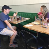 <p>U.S. Sen. Chris Murphy speaks with Fairfield resident Abigail Lorge and her daughter Eliza at the Driftwood Café in Southport during last year&#x27;s walk across Connecticut.</p>