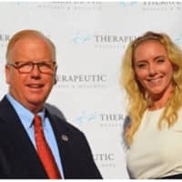 <p>Therapeutic Massage and Wellness in Danbury held a ribbon cutting for its new name, look and services. Jenna Dallinga, owner, and Danbury mayor Mark Boughton at the store&#x27;s ribbon cutting</p>