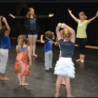 <p>DAC’s Senior Company Dancer Hannah Ferguson and Dance instructor Elizabeth Hall instruct preschool visitors in an Open House mini-dance class.</p>