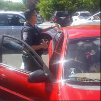<p>A Brookfield Police Officer saves a dog from inside a car, where temperatures had reached 114 degrees.</p>