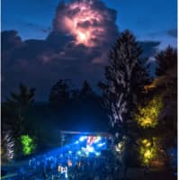 <p>Lightning approaching the recent Rebirth Arts Festival in Easton during an evening live music act</p>