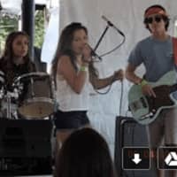 <p>A New Canaan band from the School of Rock playing in the parking lot tent</p>