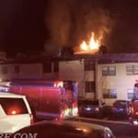 <p>Flames shoot the roof of a Purchase College dormitory shortly after the blaze was reported at 10 p.m. on Sunday. All 25 residents evacuated safely and no firefighters were hurt containing the fire by 11 p.m.</p>