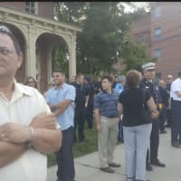 <p>About 100 people attend the Sept. 11 Memorial Remembrance Gathering on Friday at Elmwood Park in Danbury.</p>