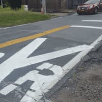<p>Newly painted pavement warnings at the Commerce Street railroad crossing, facing the Taconic State Parkway Extension in Hawthorne. Prior street markings were barely visible at night or in bad weather. This is the site of the Feb. 3, 2015 fatal crash.</p>
