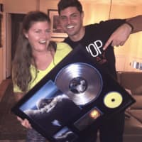 <p>Myles Moraites and his mother with his new Platinum Record.</p>