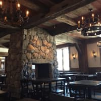 <p>The new stone fireplace dominates one of the dining rooms at Little Pub in Fairfield.</p>