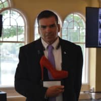 <p>Fairfield Police Chief Gary MacNamara received a trophy for his longstanding support of Walk A Mile In Her Shoes, an awareness event organized by The Center for Family Justice.</p>