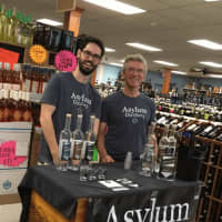 <p>Neil Doocy and Robert Schulten offer a taste of their wares at Mo&#x27;s Wine &amp; Spirits in Fairfield.</p>