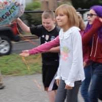 <p>Grace VanderWaal and her friends as they walk toward a stage for a reception.</p>