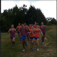 <p>Danbury High&#x27;s senior boys race in the last regular home meet of the cross country season on Tuesday at Tarrywile Park  Seniors raced in the Pat Healey team singlets.</p>