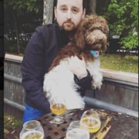 <p>New Fairfield resident Erik Ofgang and his labradoodle Iris. Ofgang is the author of &quot;Buzzed: Beers, Booze &amp; Coffee Brews.&quot;</p>