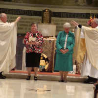 <p>Blauvelt Dominican Sisters Carol Carullo, left, and Dorothy Maxwell, right, renew their vows at their Golden Jubilee Liturgy.</p>