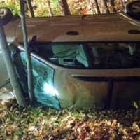 <p>A look at the vehicle involved in the rollover crash into the woods on Route 35 in Somers on Thursday night.</p>
