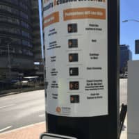 <p>Instructions at the new High-Intensity Activated Crosswalk (HAWK) signals, which have been installed in two locations on Washington Boulevard.</p>