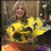 <p>Susan Palazzo, co-owner of City Line Florist in Trumbull, preparing bouquets for Petal It Forward Day on Wednesday, Oct. 19.</p>