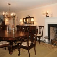 <p>The home has several original working fireplaces, including this one in the dining room.</p>