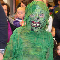 <p>Damian Rousseau of Westport, 8, dressed as the swamp monster at the Halloweed Event at the Westport Town Hall</p>