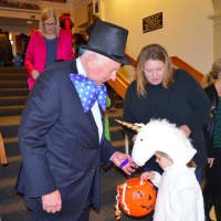 <p>Westport First Selectman Jim Marpe, dressed in a mayor&#x27;s costume, greets kids and gives out candy at the 20th annual Halloween event, which was held this year at Westport Town Hall.</p>