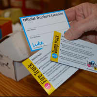 <p>Each toy truck comes with a trivia card.</p>