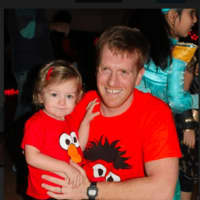 <p>Darien Y fitness instructor Peter Laura poses with his daughter Gracyn Laura</p>