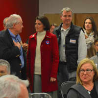 <p>State Rep. Cristin McCarthy Vahey, center, talks with First Selectman Michael Tetreau, left, at Democratic campaign headquarters in Fairfield.</p>