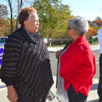 <p>State Sen. Marilyn Moore, center, chats with a voter, while U.S. Sen. Chris Murphy, second from right, talks to another constituent outside Wilbur Cross School in Bridgeport Tuesday.</p>