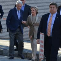 <p>Hillary and Bill Clinton leave Chappaqua&#x27;s Douglas G. Grafflin Elementary School after casting their presidential votes. The pair walked to a large crowd of supporters and journalists.</p>