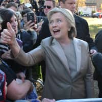 <p>Hillary Clinton gives a thumbs up while meeting with supporters and reporters after casting her presidential vote in Chappaqua.</p>