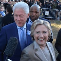 <p>Hillary and Bill Clinton walk by supporters and reporters in front of Douglas G. Grafflin Elementary School in Chappaqua after casting their presidential votes.</p>