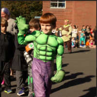 <p>Kindergartner Quinn deSpoelberch shows off his Hulk costume at the Holmes School Halloween parade on Monday, Oct. 31.</p>